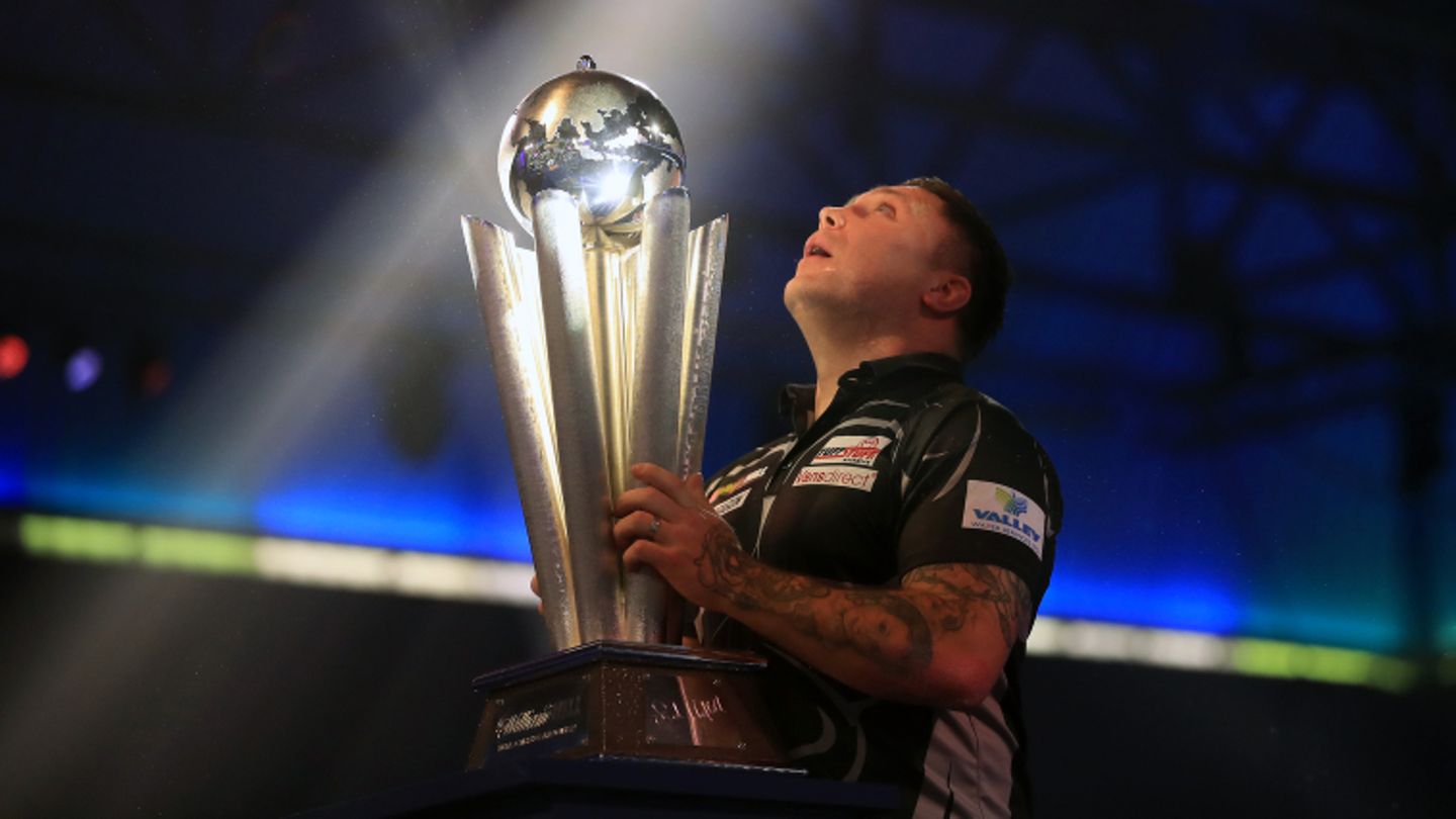 He has done it: The new Darts world champion Gerwyn Price from Wales stretches proud of his trophy.