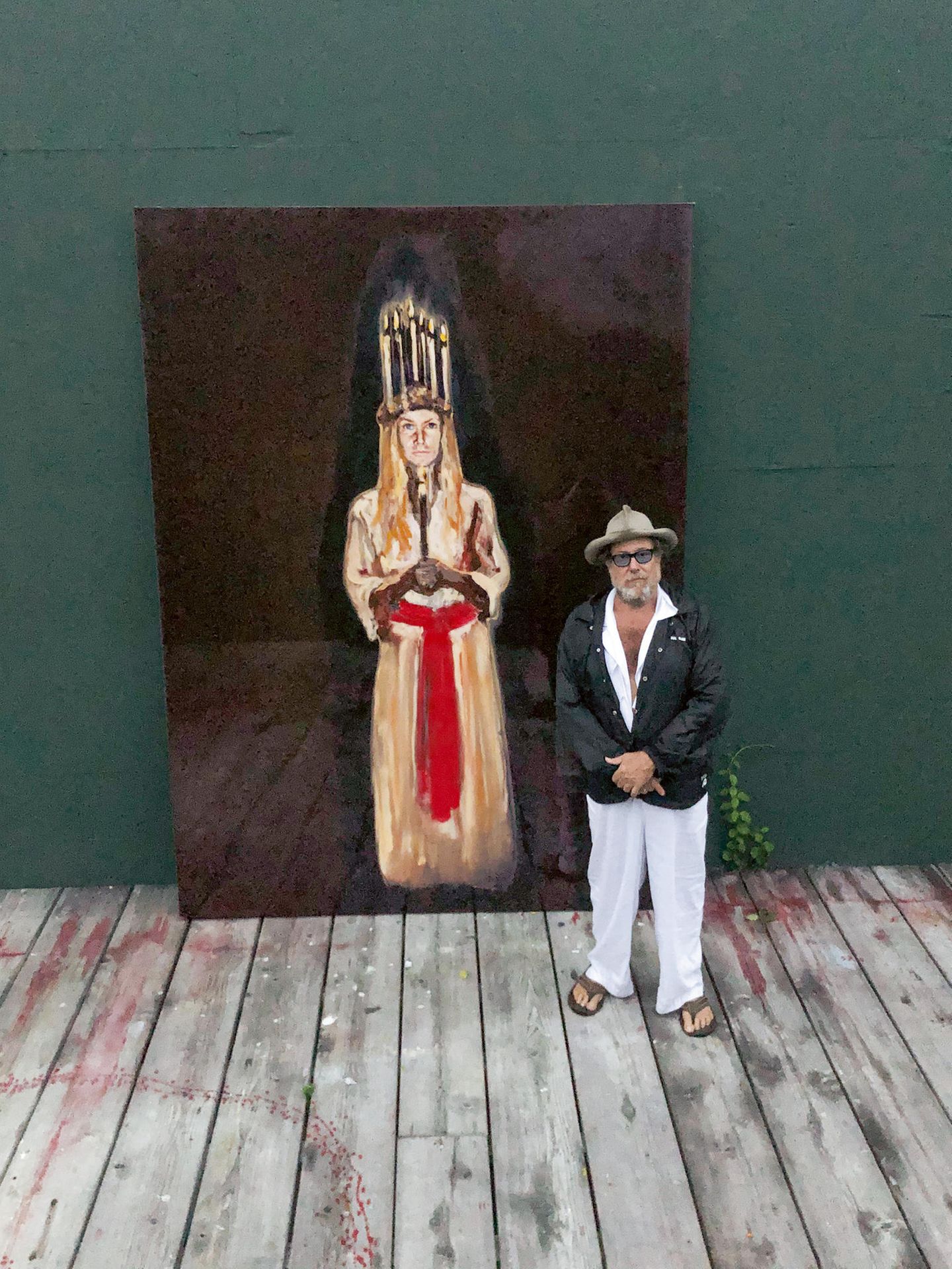 Julian Schnabel in front of the painting Portrait of Louise as St. Lucia, 2020