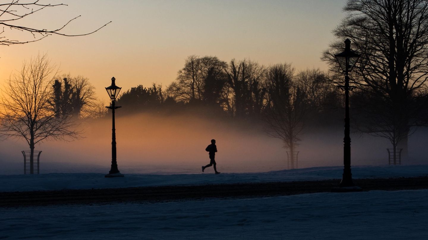 Jogging start: Jogger runs into the early hours of the morning in the fog